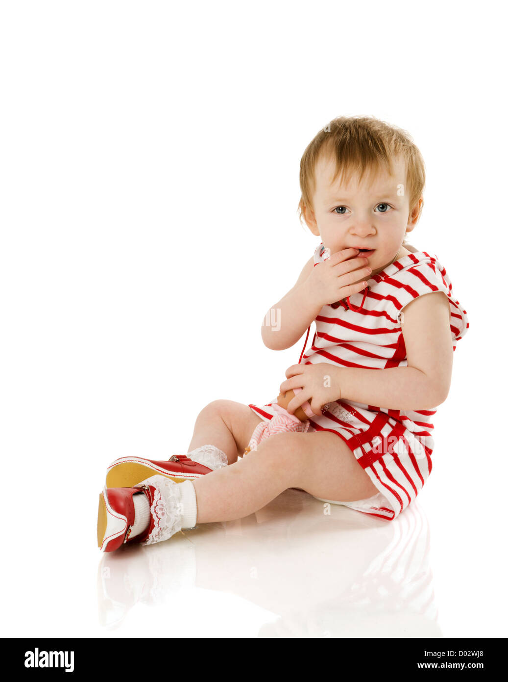 Little girl sitting on floor isolated hi-res stock photography and