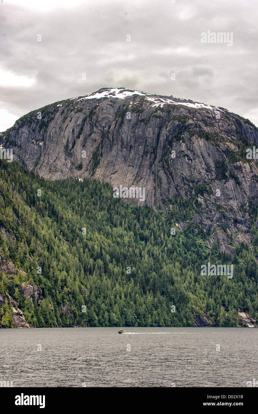 July 6, 2012 - Ketchikan Gateway Borough, Alaska, US - Sculpted by massive glacier action the 50 to 70 million year old towering granite walls in Misty Fjords Rudyerd Bay soar as high as 3,000 ft (900m) and are counter balanced by evergreen rain forests. Misty Fjords National Monument and Wilderness Area, along the Inside Passage coast of southeastern Alaska, is administered by the U.S. Forest Service and covers 2,294,343Â acres (9,246Â km) of Tongass National Forest, the largest wilderness in Alaskan national forests and is only accessible by floatplane or boat. (Credit Image: © Arnold Drapki Stock Photo
