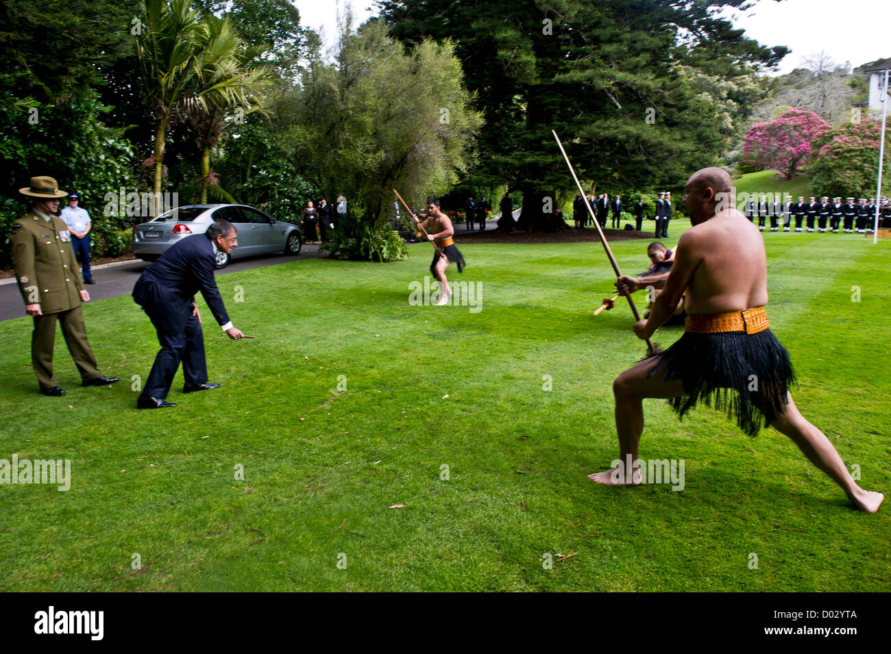 Secretary of Defense Leon Panetta is issued a wero, or challenge by Maori warriors during a Powhiri ceremony September 21, 2012 while visiting Auckland, New Zealand. Panetta picked up the rakau tapu, or dart while keeping eye contact with the warrior. The ceremony is an ancient Maori tradition used to determine if visitors came in peace or with hostile intent. Stock Photo