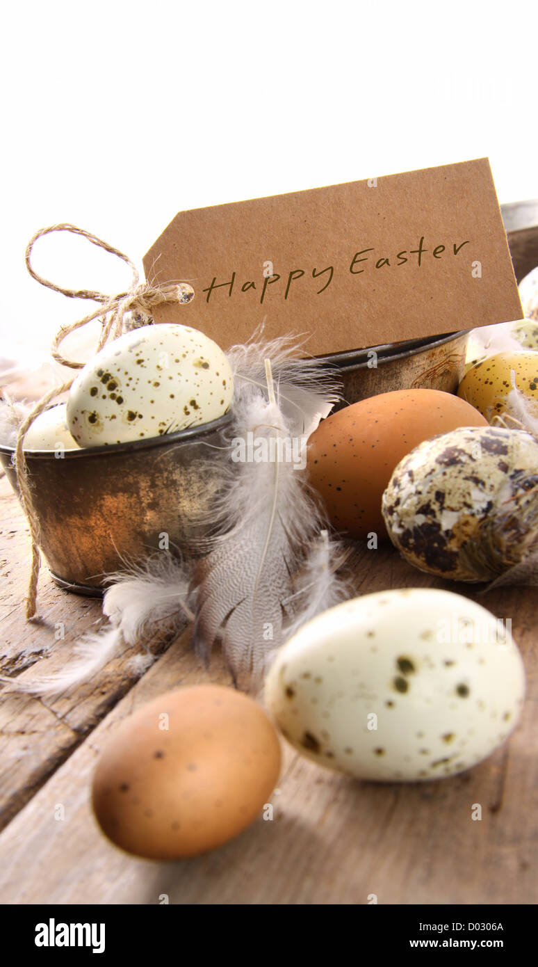 Brown speckled eggs  with easter card on wooden table Stock Photo
