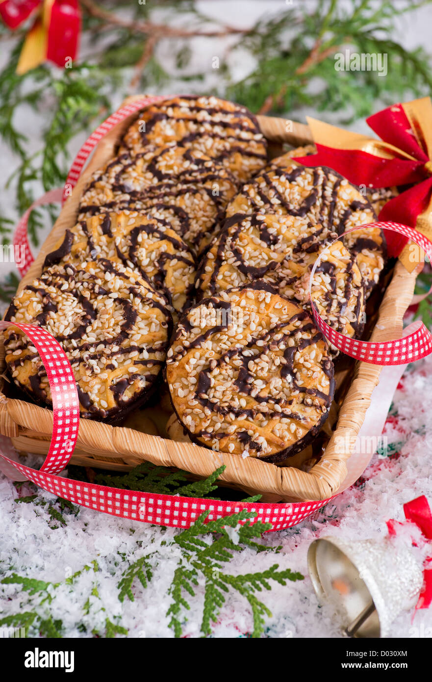 Christmas cookies in square basket with festive decoration and snow, closeup Stock Photo