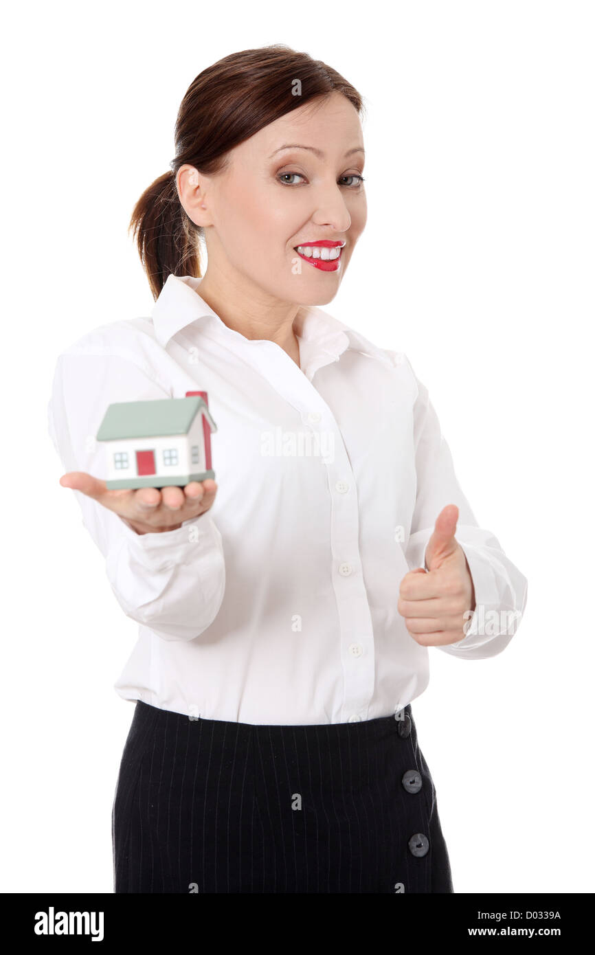 Mature beautiful business woman with house model - real estate Stock ...