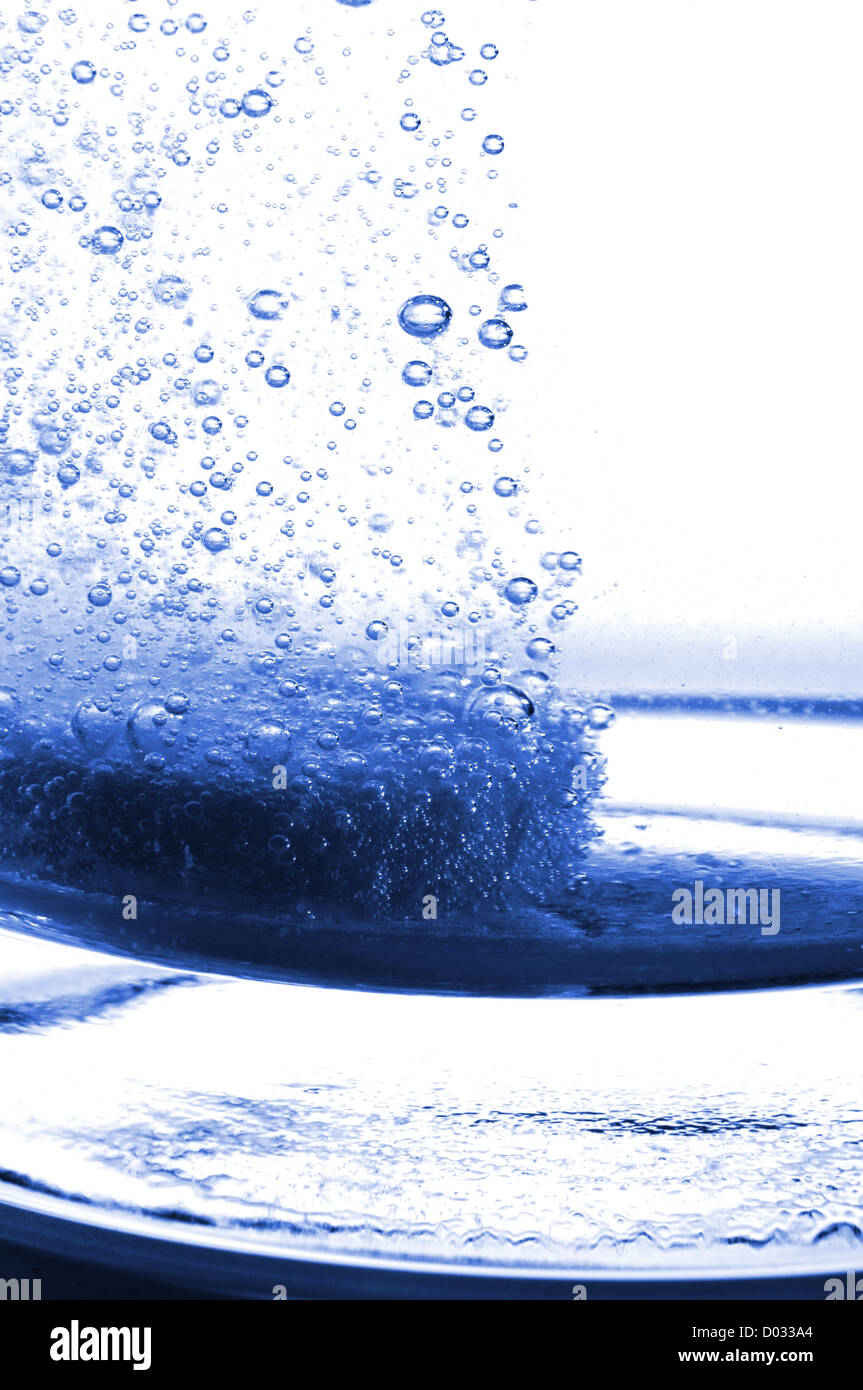 tablet or pain killer in a glass of water with copyspace Stock Photo