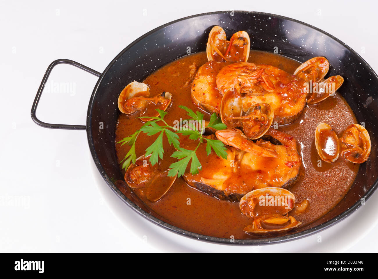 Hake pan, Spanish recipe with seafood in cider sauce Stock Photo Alamy