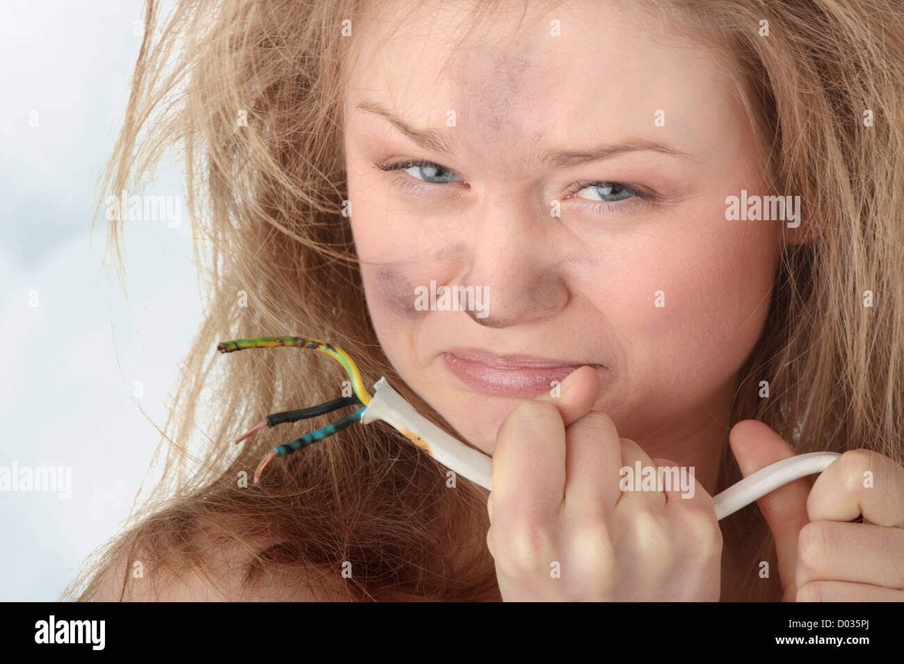 Young woman with wire electric shock Stock Photo Alamy