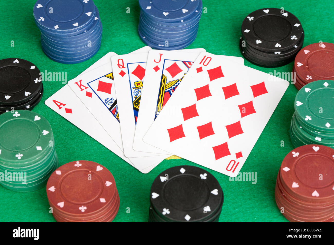 Poker cards with straight flush and many chips Stock Photo Alamy