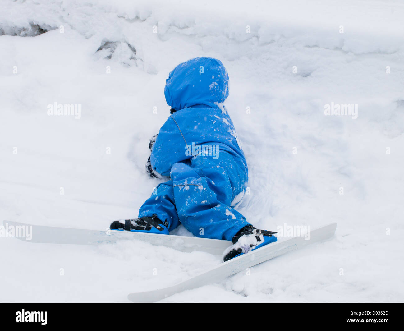 Three year old boy learning to ski, cross country Nordic skiing, first