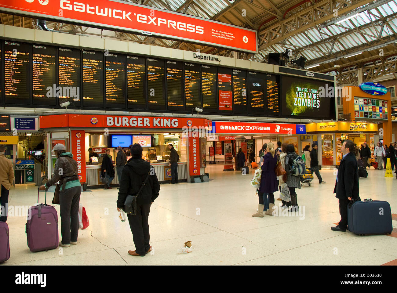 Victoria station, main hall, travelers looking at departure board, London, England, United Kingdom, Europe Stock Photo