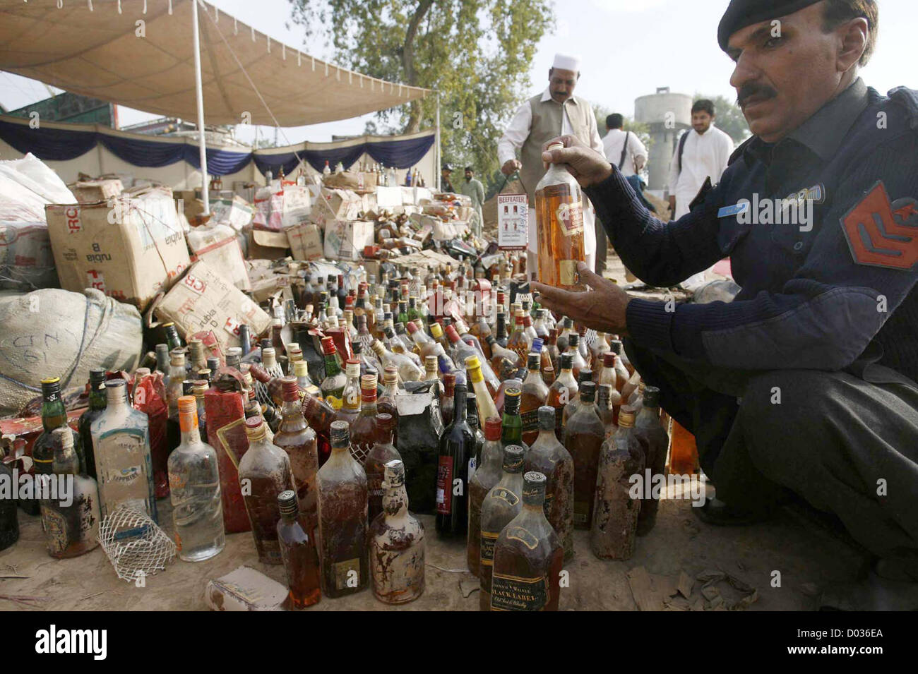 Customs officials inspect huge quantity of seized liquor bottles before