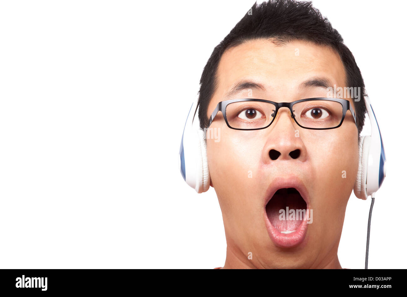 surprised young man in headphone Stock Photo Alamy