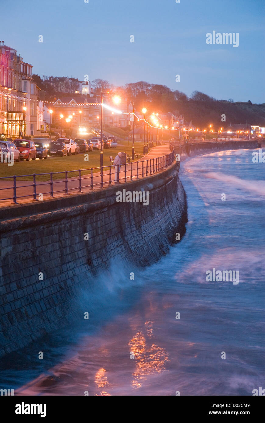 Filey Bay and seafront looking up the promenade as day turns to night. Stock Photo