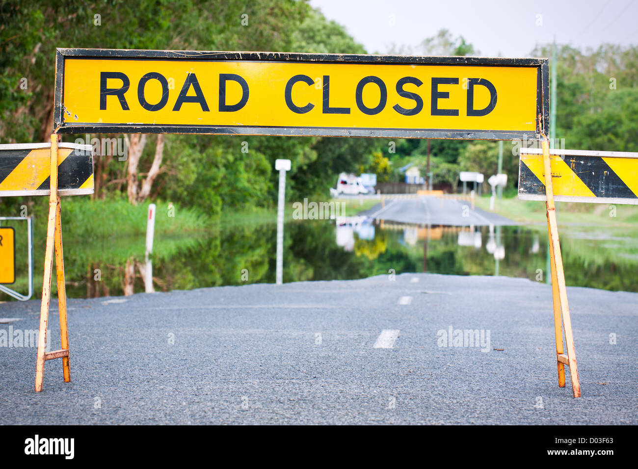 A road closed sign on a flooded road in Queensland, Australia Stock