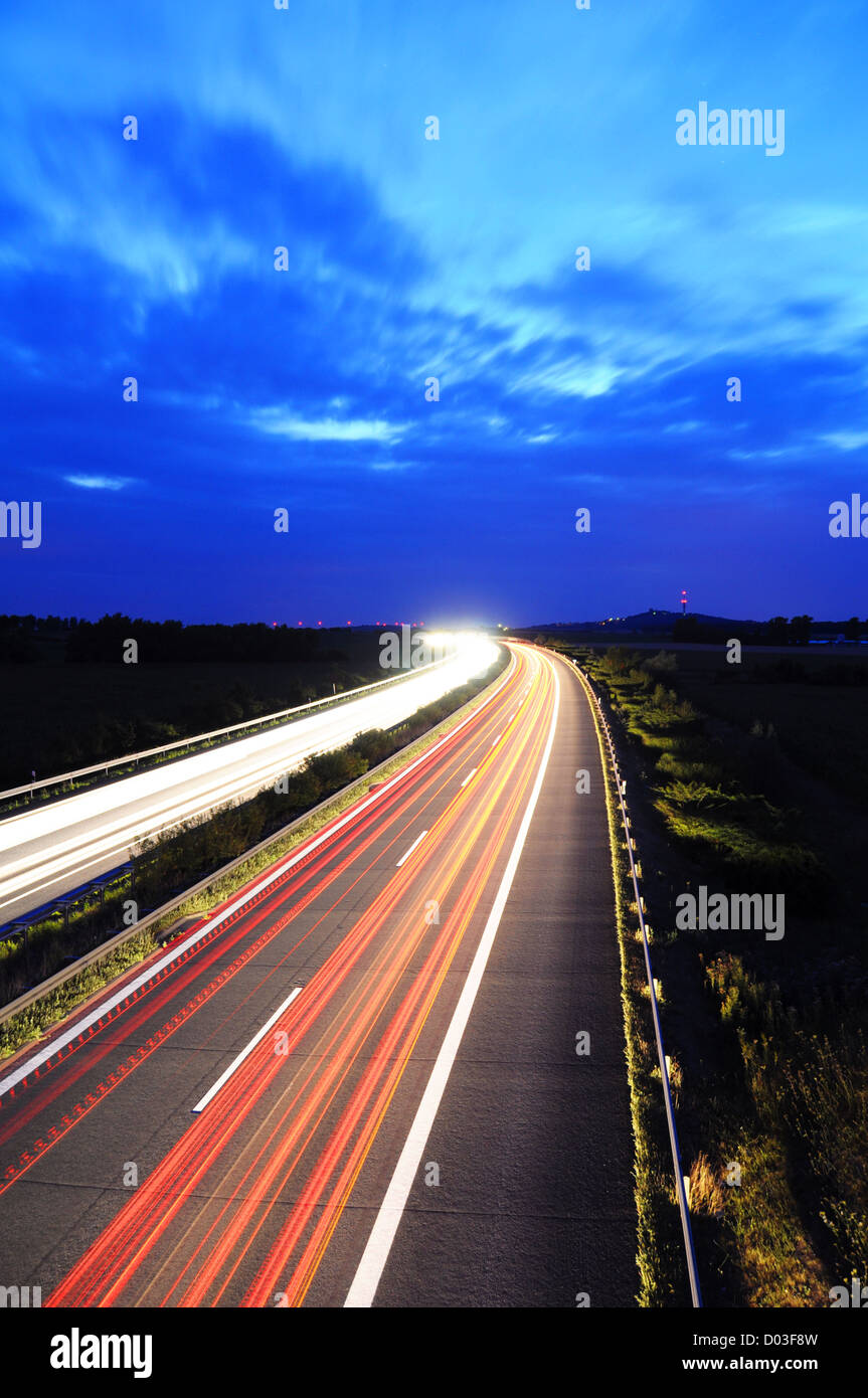 night traffic motion blur on highway showing car or transportation concept Stock Photo