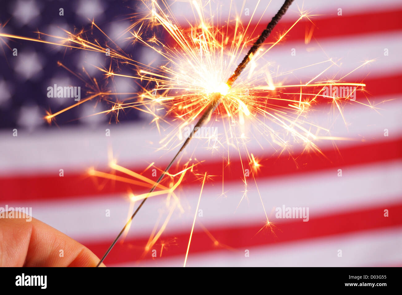 sparkler and usa flag showing 4th of july Stock Photo - Alamy
