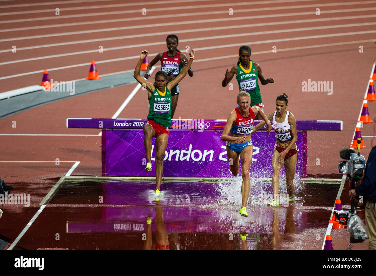 Action of women competing in the Women's 3000m Steeplechase at the