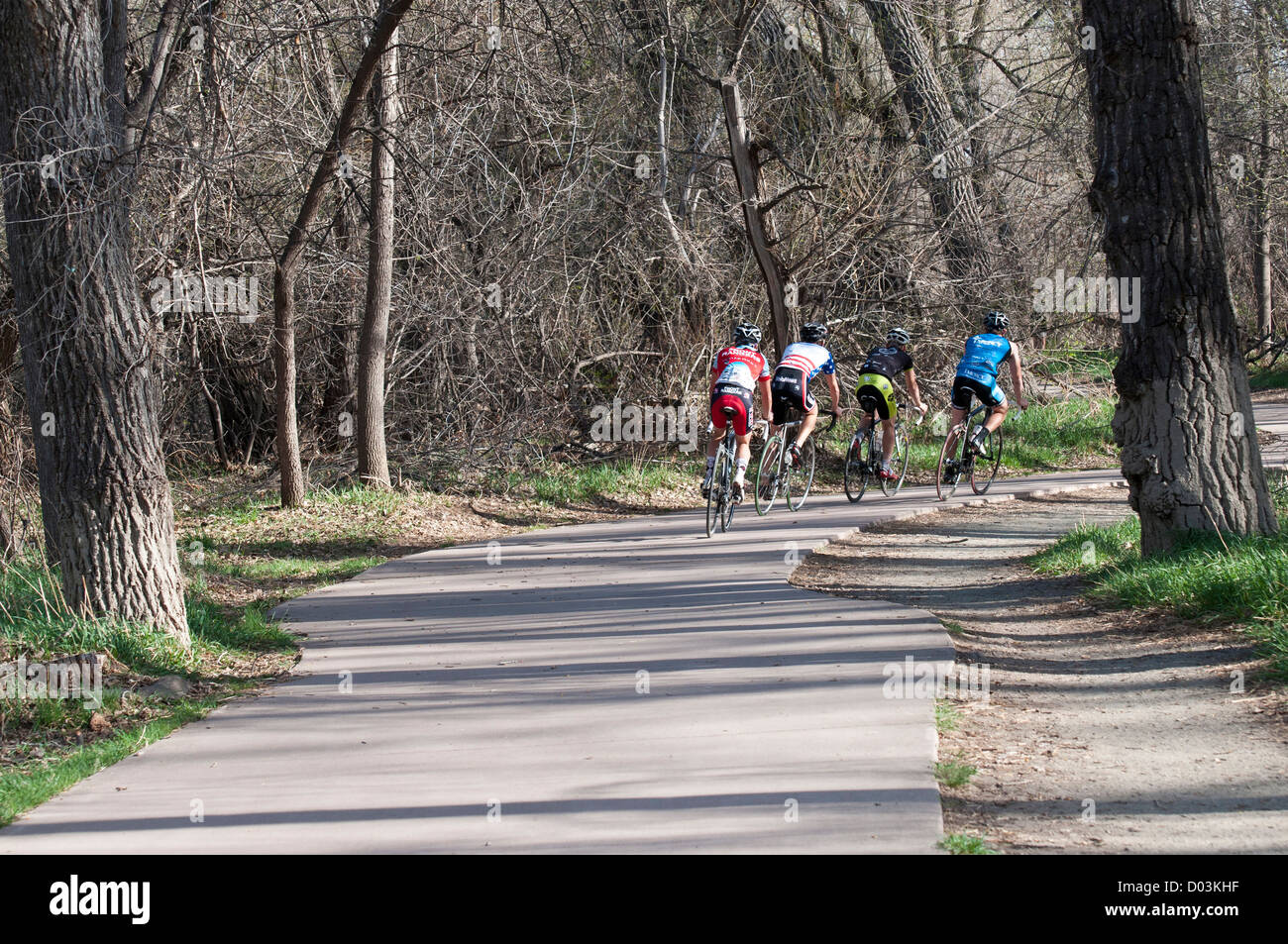 USA, CO, Fort Collins. Extensive bike path system throughout Fort Collins. Here group of cyclists on Poudre River Trail Stock Photo