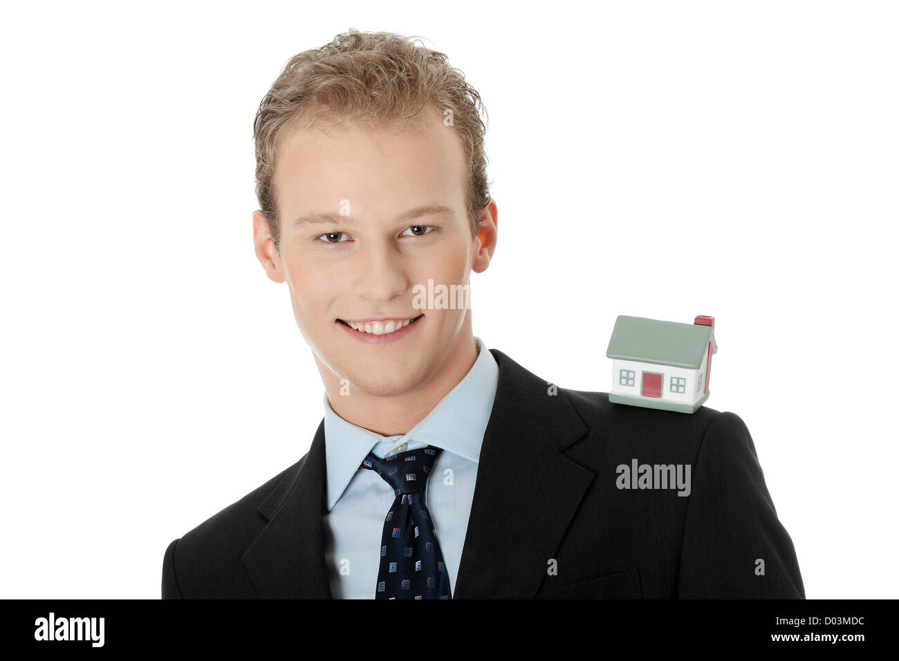 Young business man with house model Stock Photo