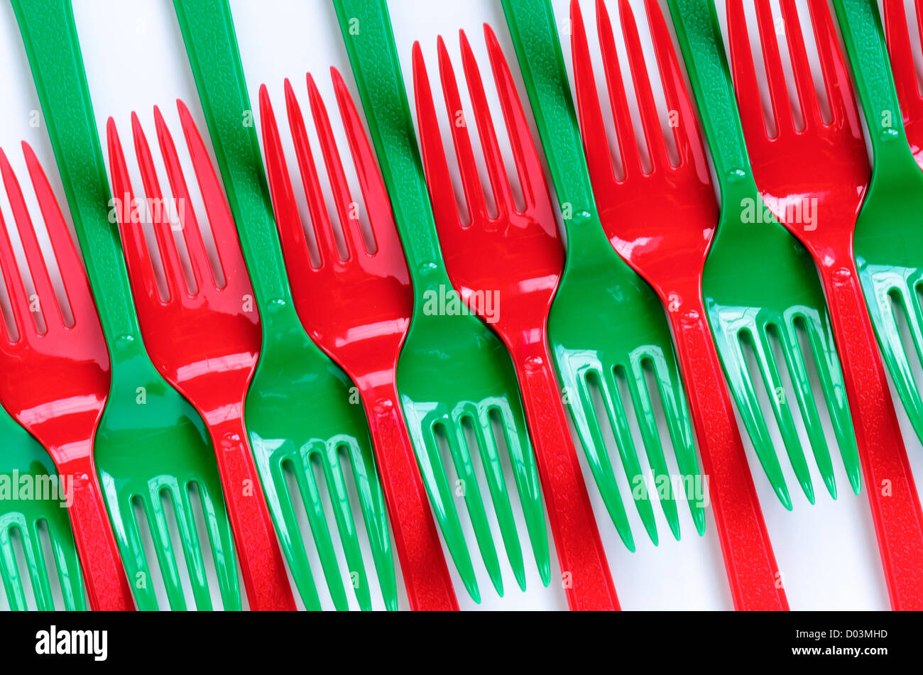 Row of red and green plastic forks Stock Photo