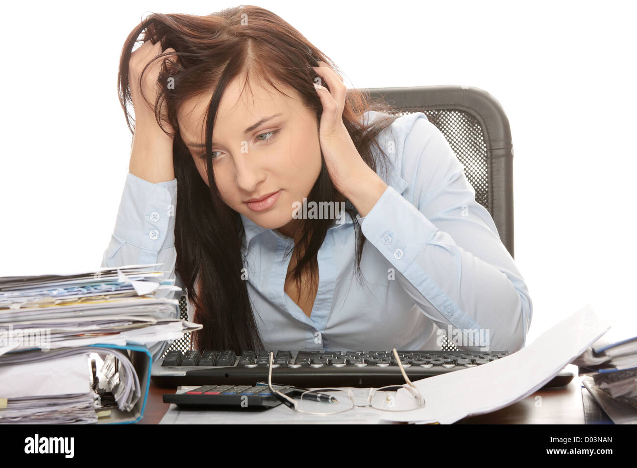 Exhausted female filling out tax forms Stock Photo - Alamy