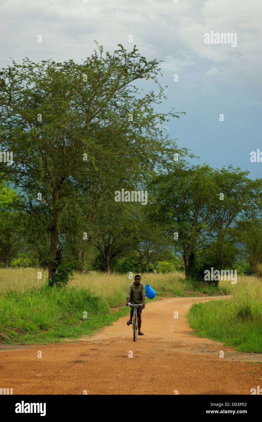Boy riding a bicycle. Uganda, Africa. Stock Photo