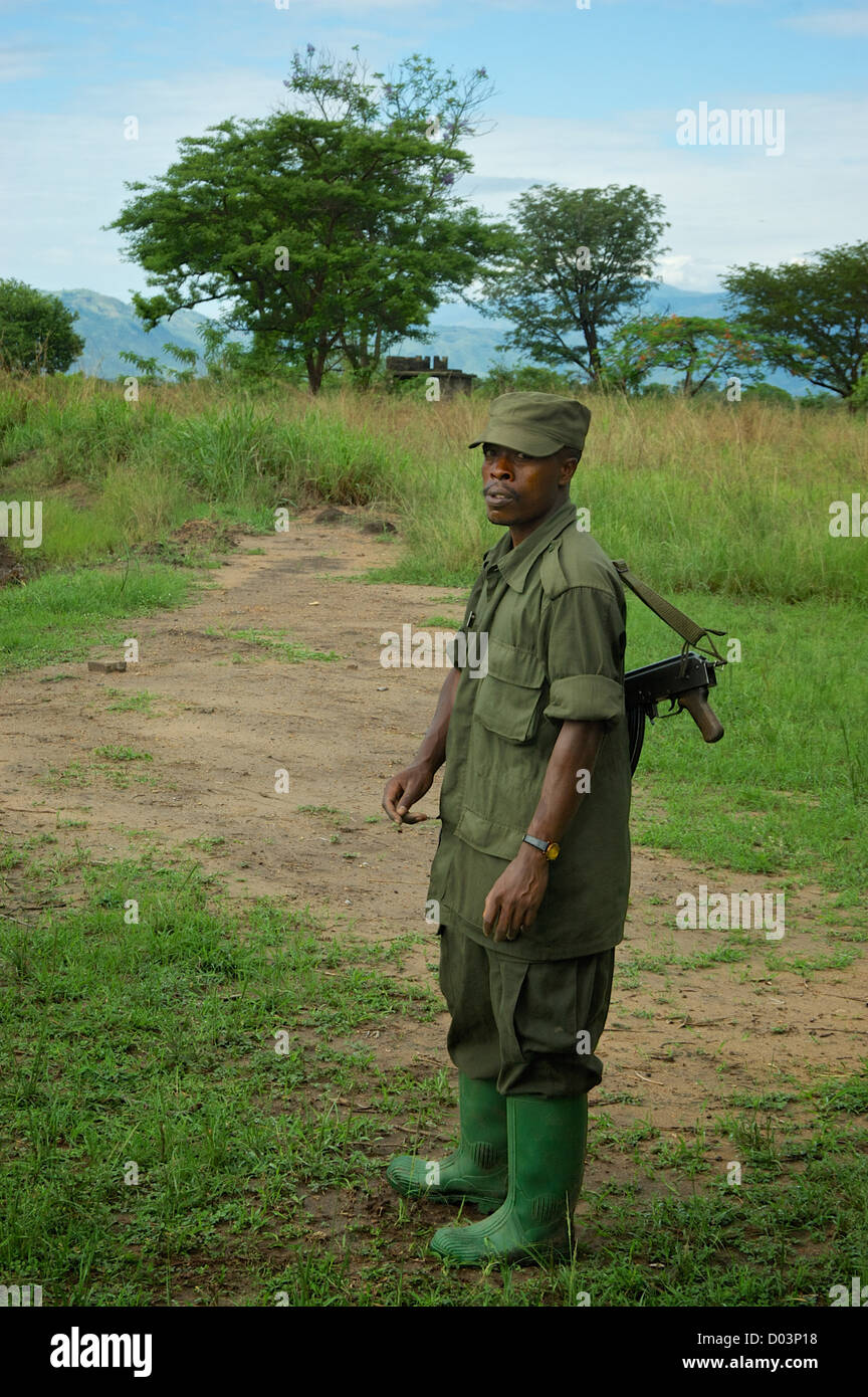 Portrait of a man with a gun. Uganda, Africa. Stock Photo