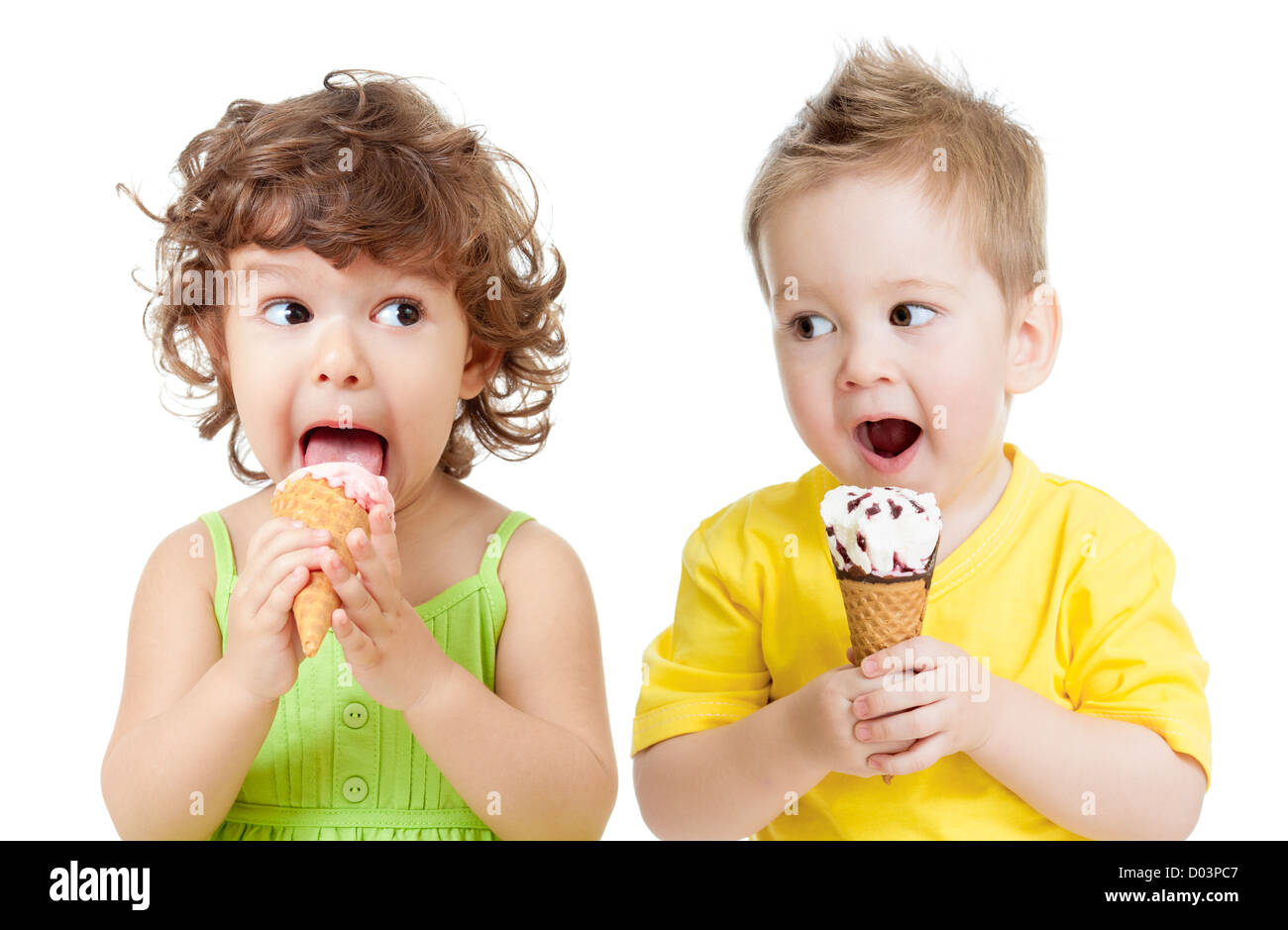 children or kids, little girl and boy eating ice cream isolated on white Stock Photo