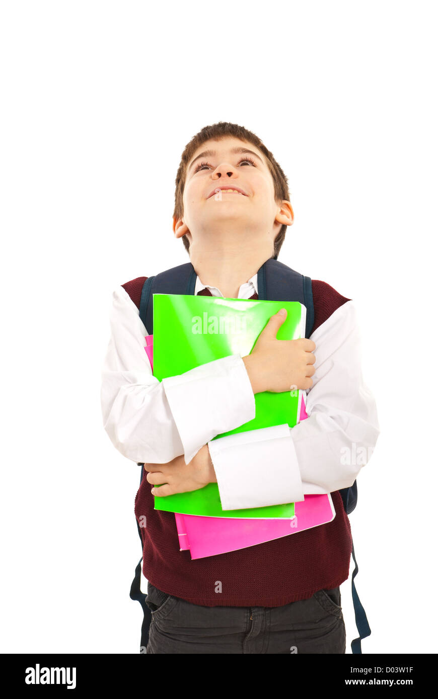 Schoolboy holding notebooks and looking up isolated on white background ...
