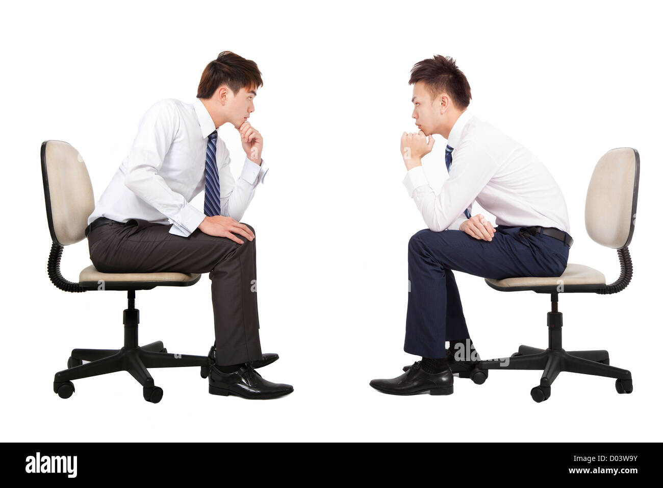 two businessman thinking and looking each other Stock Photo