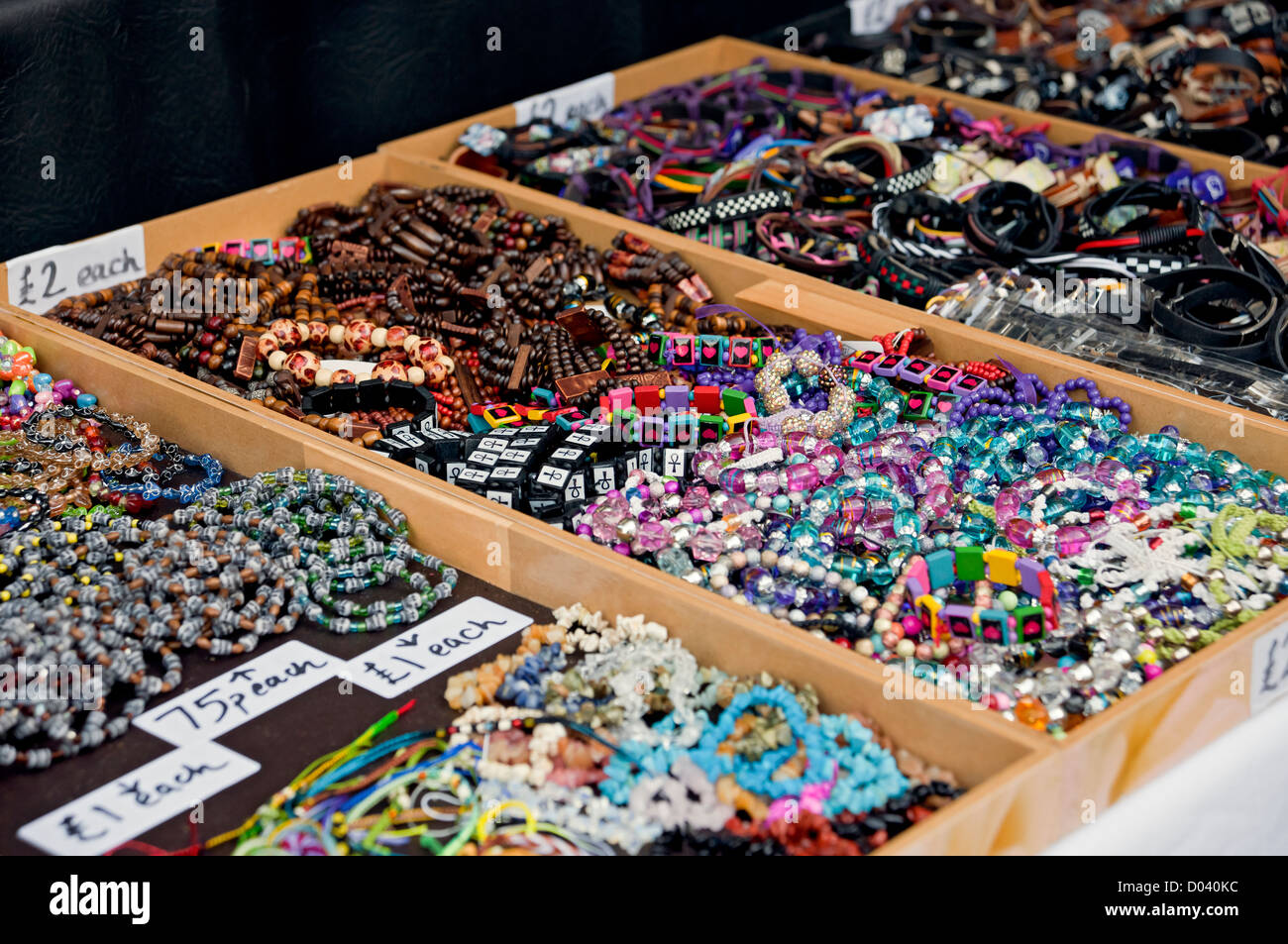 Close up of trays of bead bracelets fashion jewellery for sale on a
