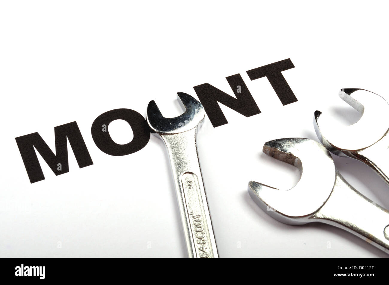 mount or mounting concept with tool and word Stock Photo - Alamy