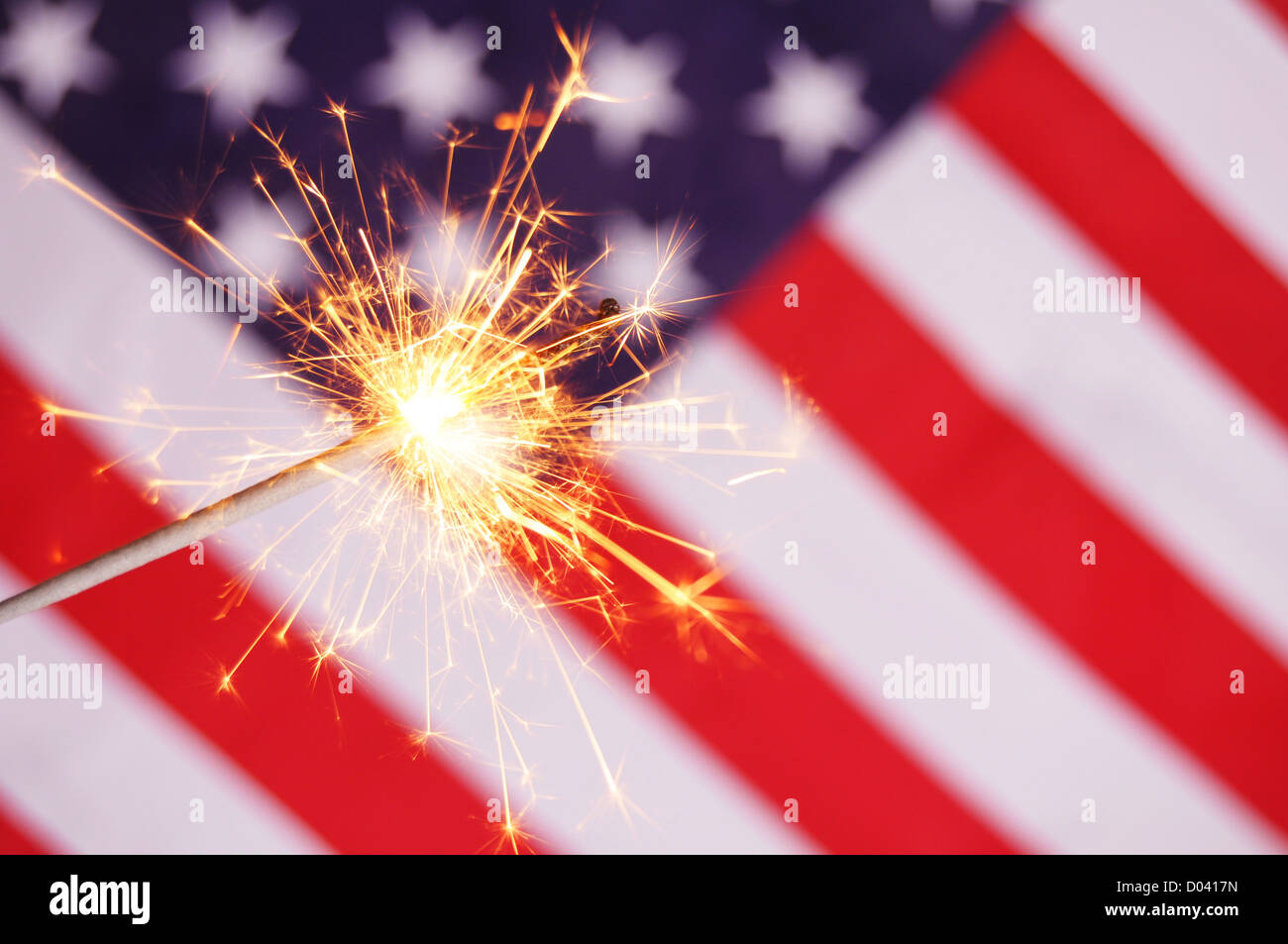 sparkler and usa flag showing 4th of july Stock Photo - Alamy