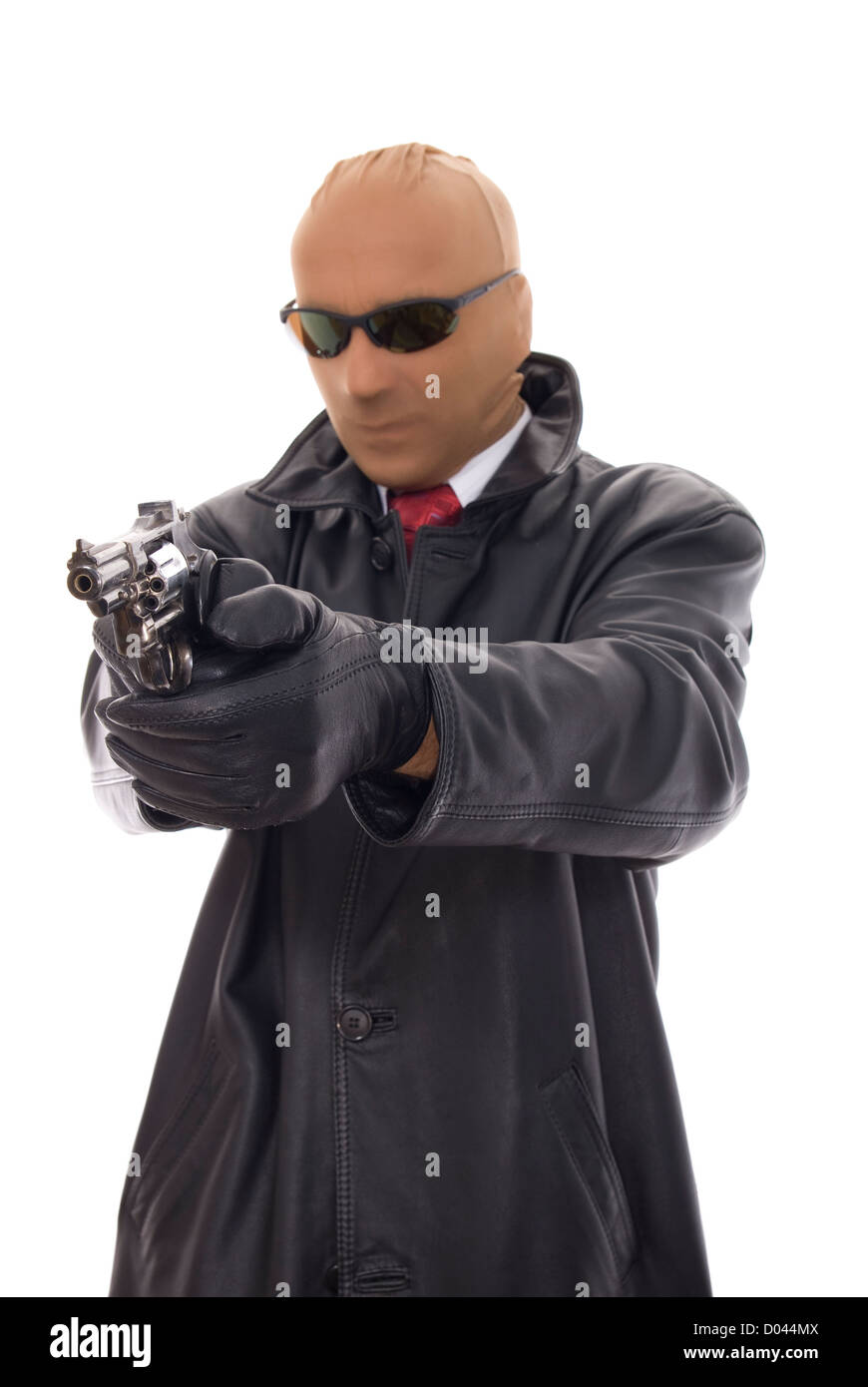 masked bandit in leather jacket with gun Stock Photo