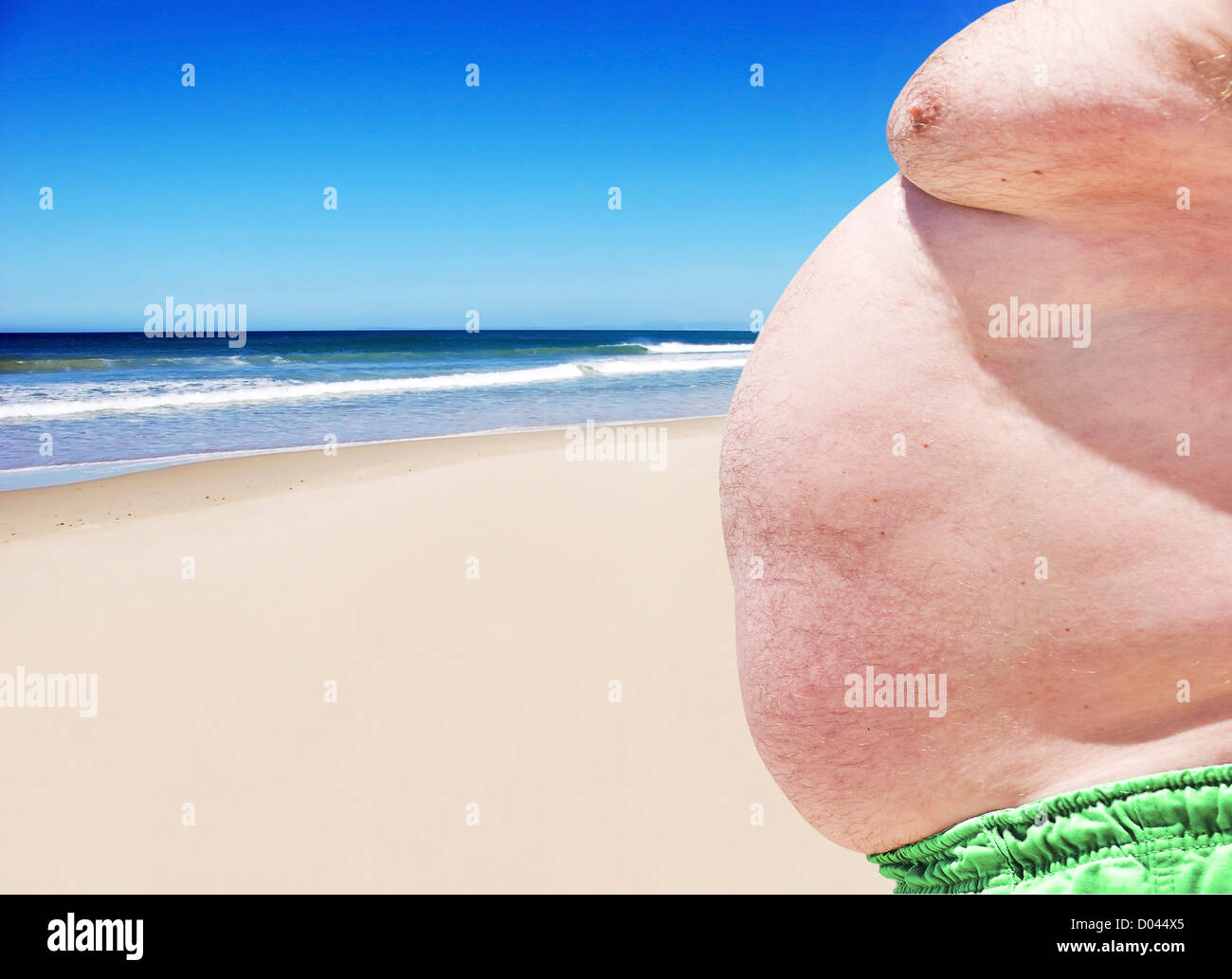 Close up of three obese fat men of the beach Stock Photo