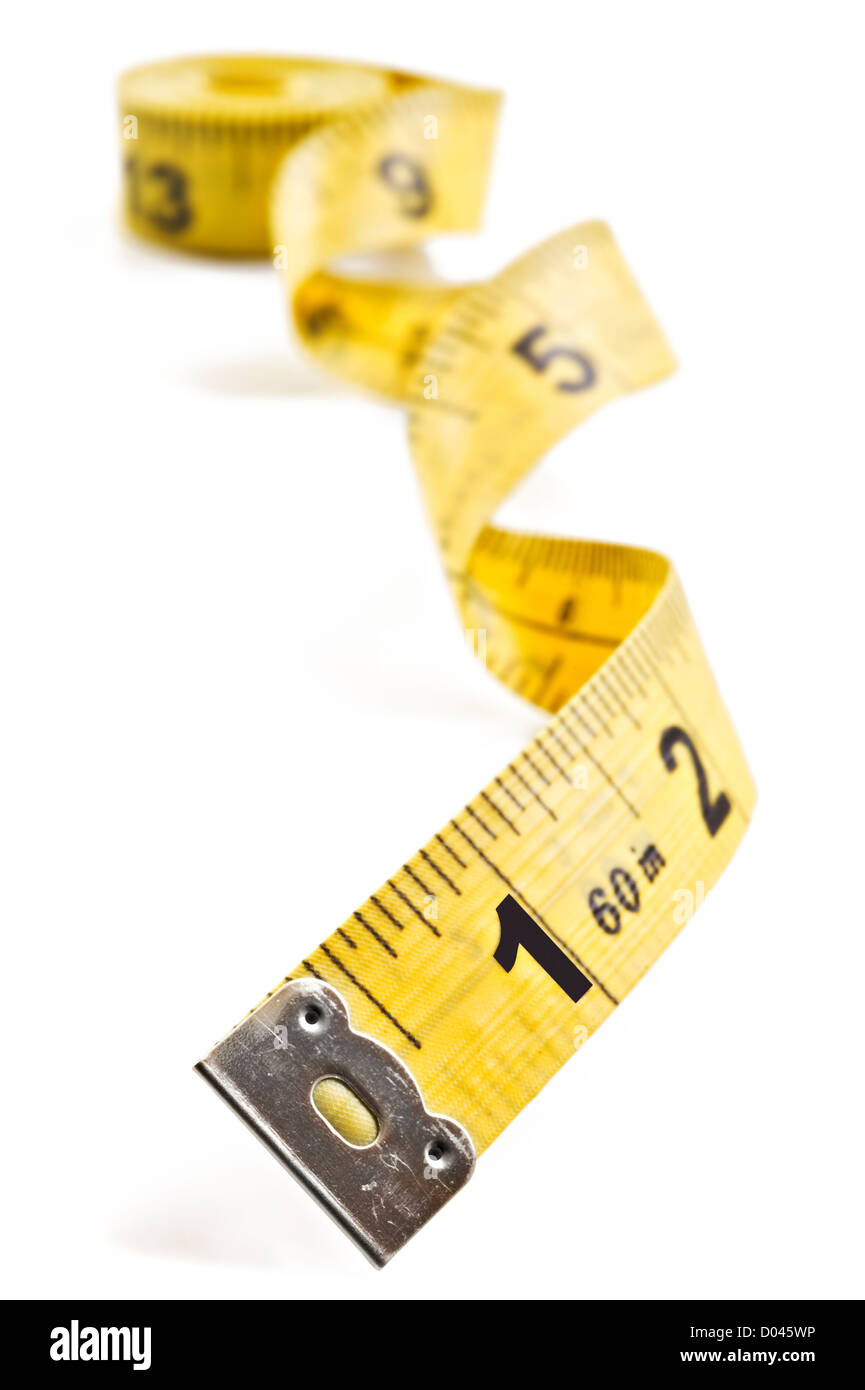 Two rolled-up white and yellow tailor measuring tape on an old wooden  surface Stock Photo - Alamy