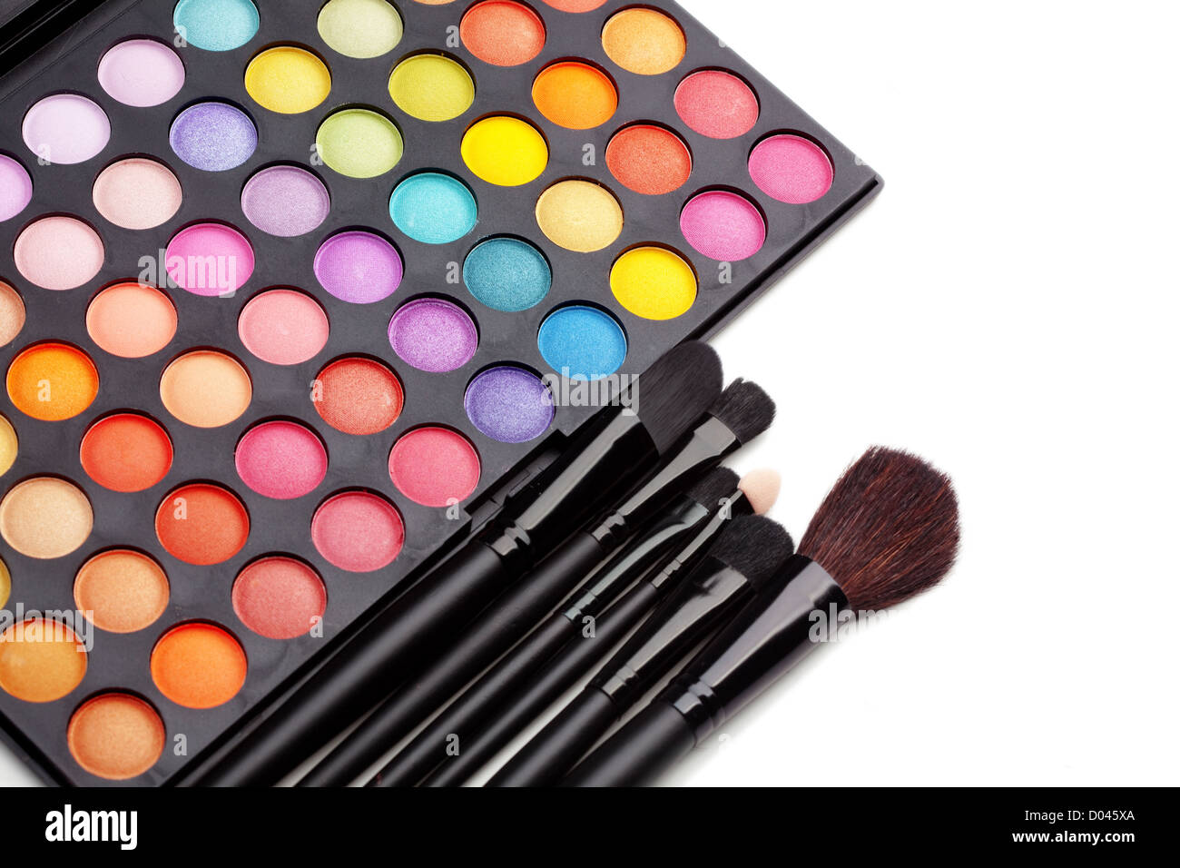 Make-up colorful eyeshadow palette with makeup brushes on it Stock Photo