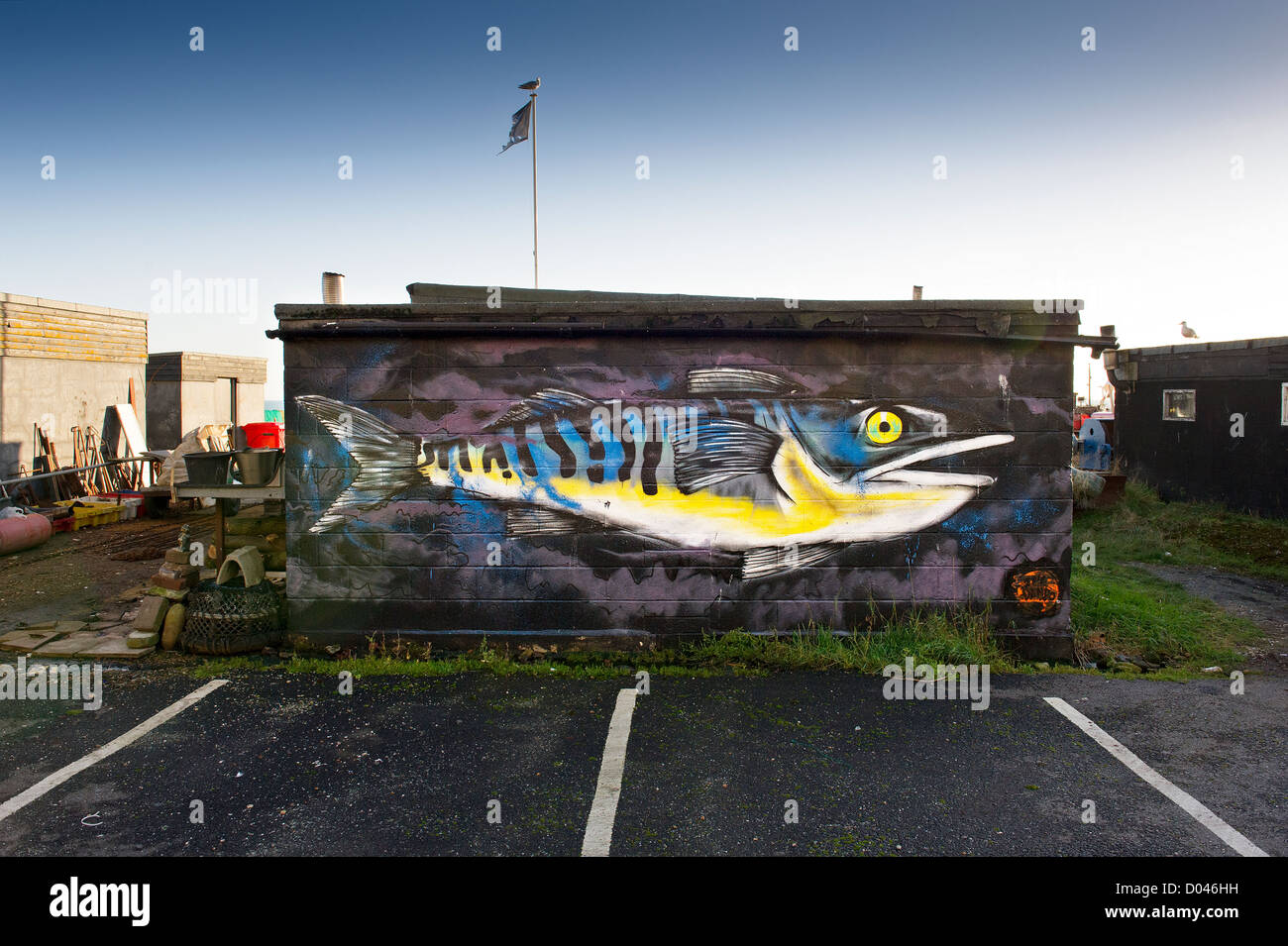 A painting of a mackerel on the side of building on the Stade in Old Hastings. Stock Photo