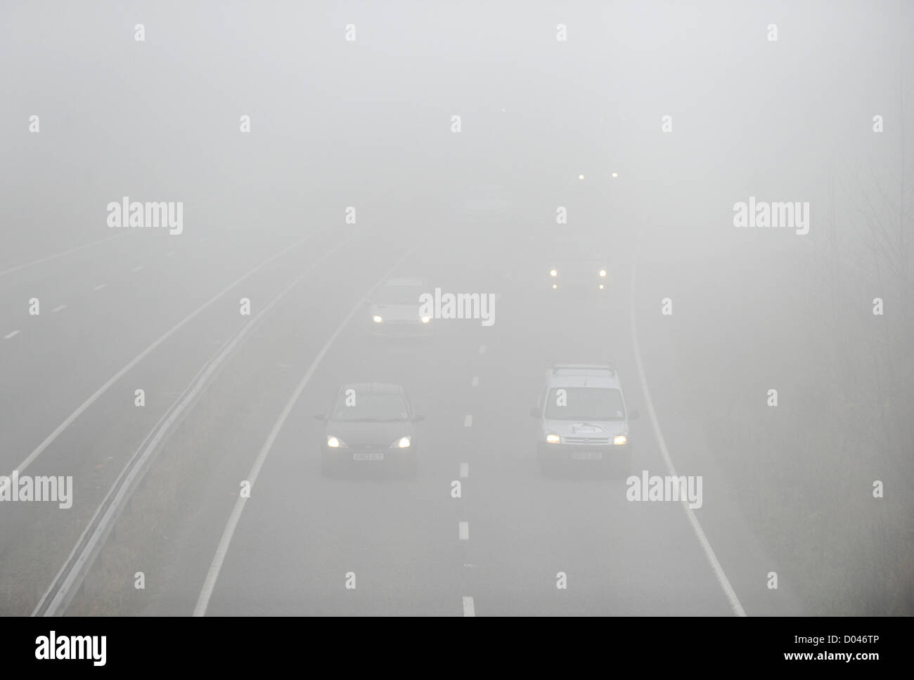 Brighton Sussex UK 16 November 2012 - Traffic driving through thick fog along the A27 Brighton by-pass today Stock Photo