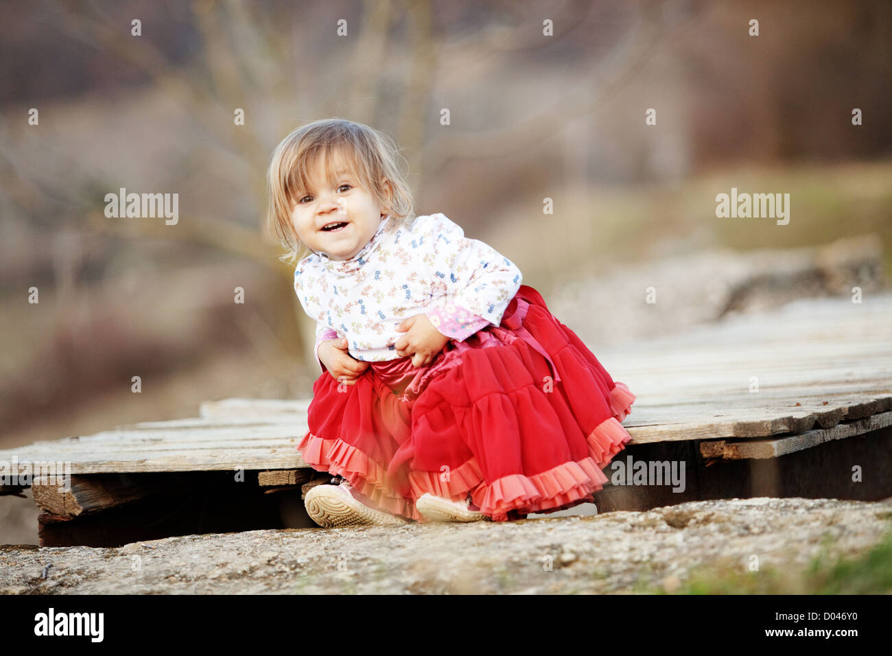 Adorable toddler on wooden bridge Stock Photo - Alamy
