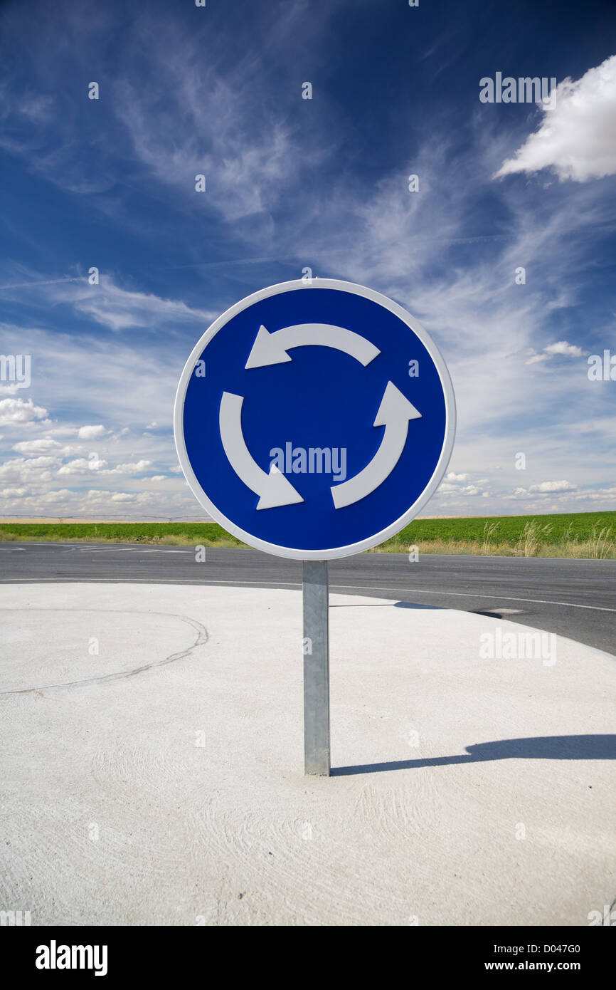roundabout blue signal in a road at Arevalo Spain Stock Photo