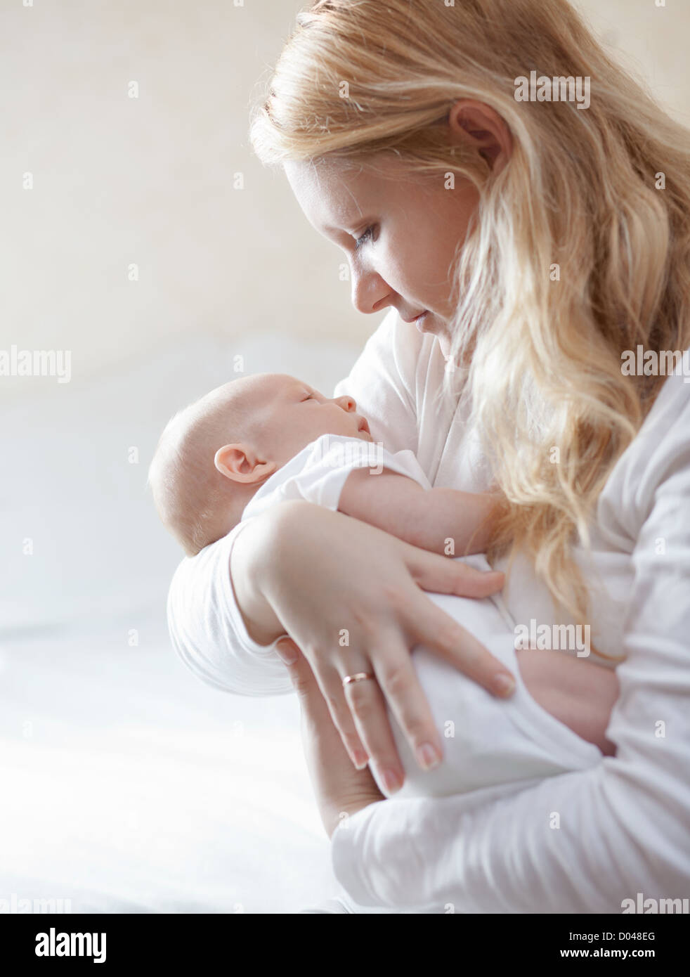 Portrait of a mother with her newborn baby Stock Photo