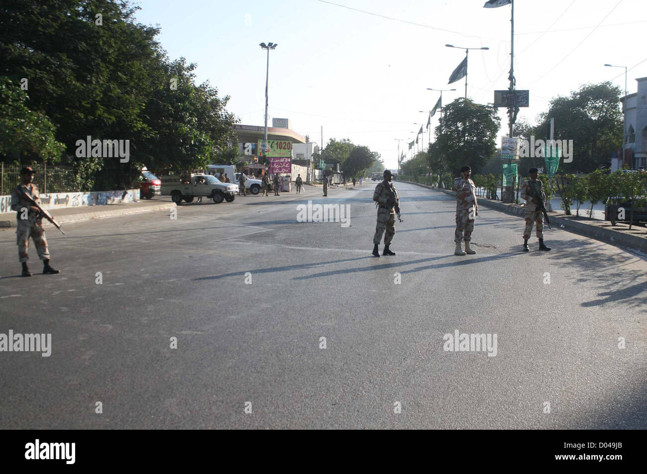 Rangers officials stand alert to avoid any untoward incident  during rally of Ahle Sunnat Wal Jamat (Defunct Sipah-e-Sahaba) in connection of Death  Anniversary of 2nd Orthodox Caliph Hazrat Umar Farooq, at M.A Jinnah Road in Karachi on  Friday, November 16, 2012. Ahle Sunnat Wal Jamat demanding to Government of Pakistan  declared his Martyrdom Day as public holiday. Stock Photo