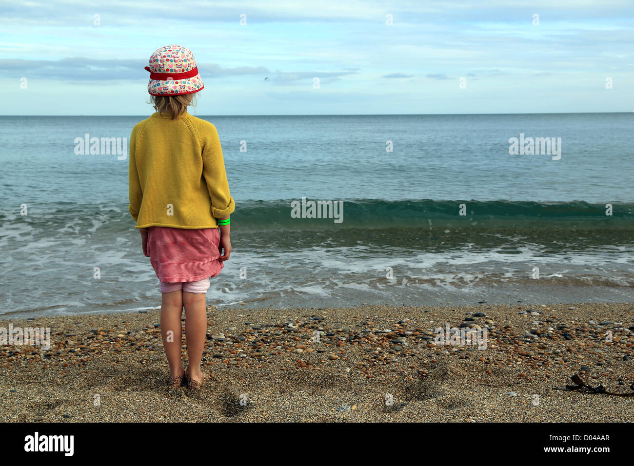 Young Girl standing on the Shore Stock Photo - Alamy