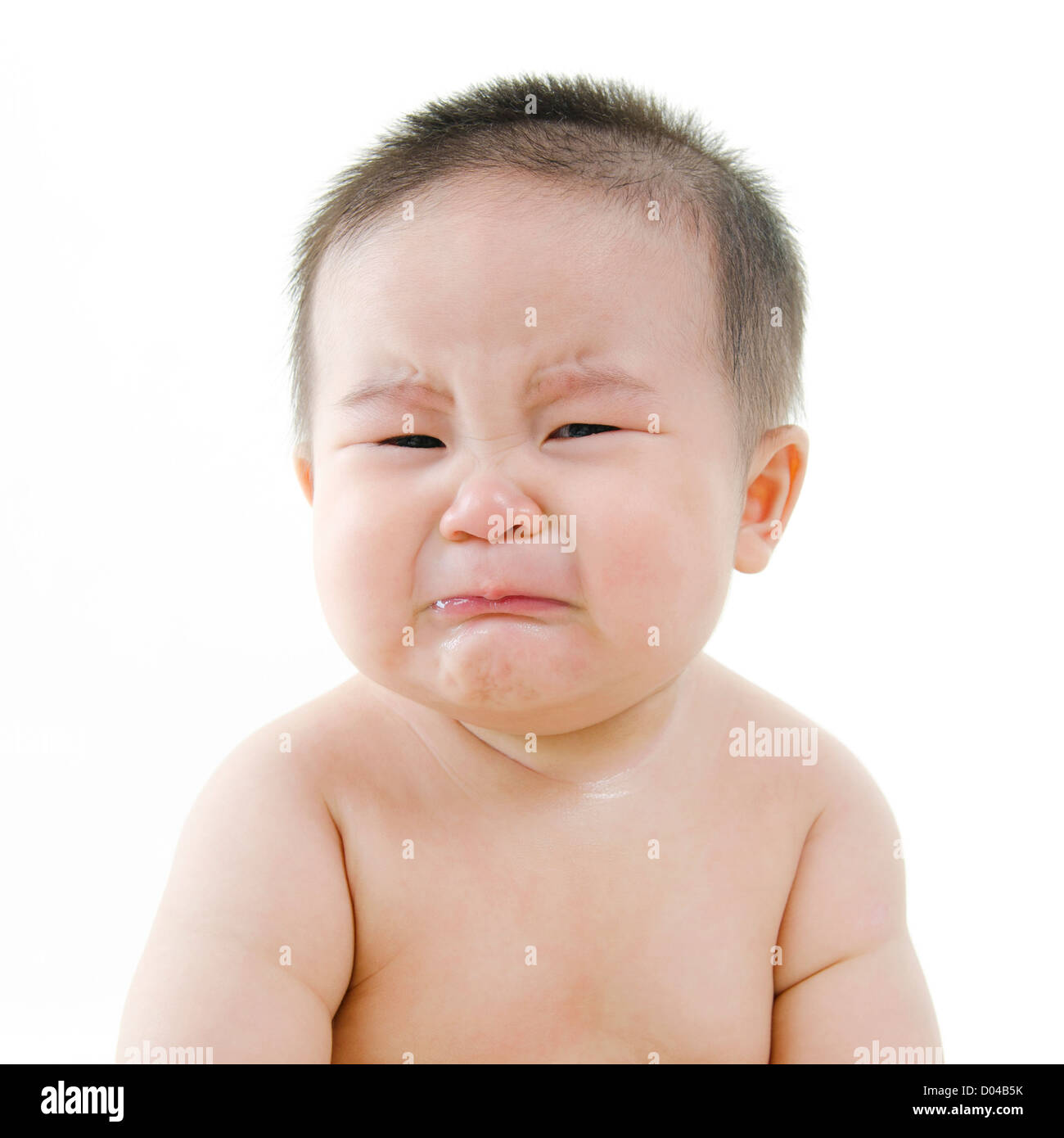 Crying Asian baby on white background Stock Photo