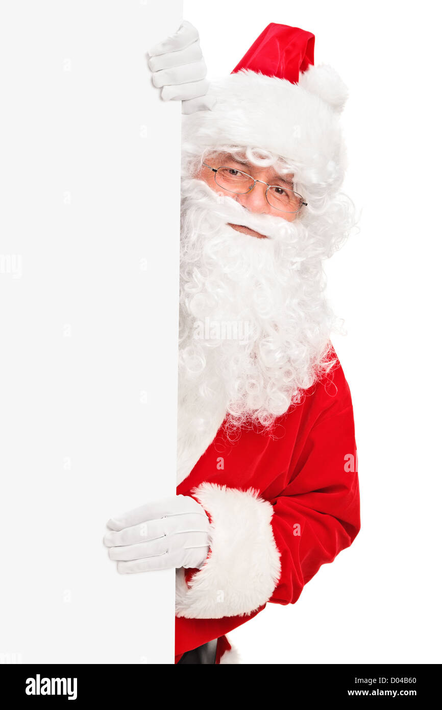 Smiling Santa Claus posing behind a blank panel isolated on white ...