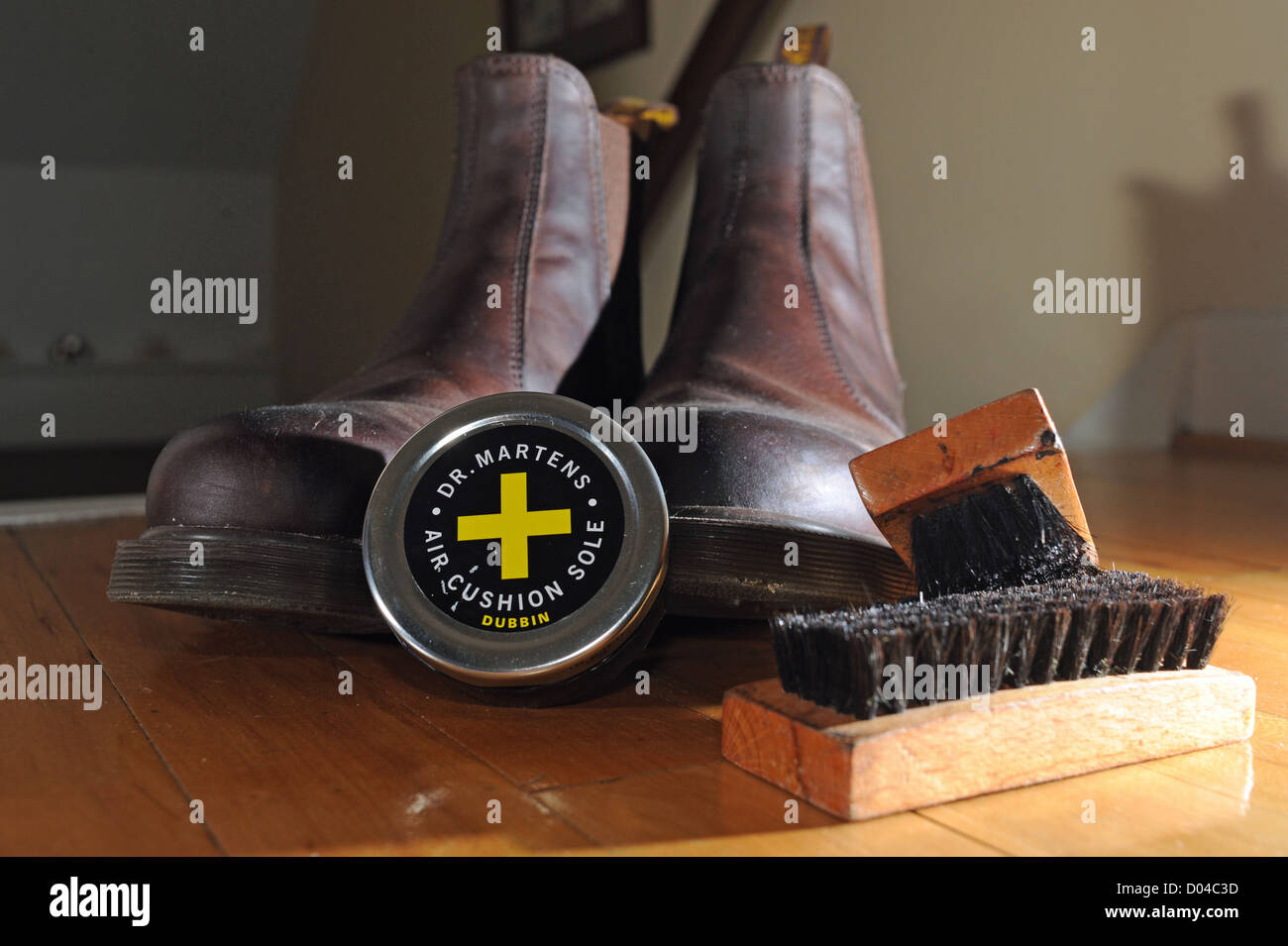 Pair of brown leather Martens boots with dubbin shoe polish can Stock Photo - Alamy