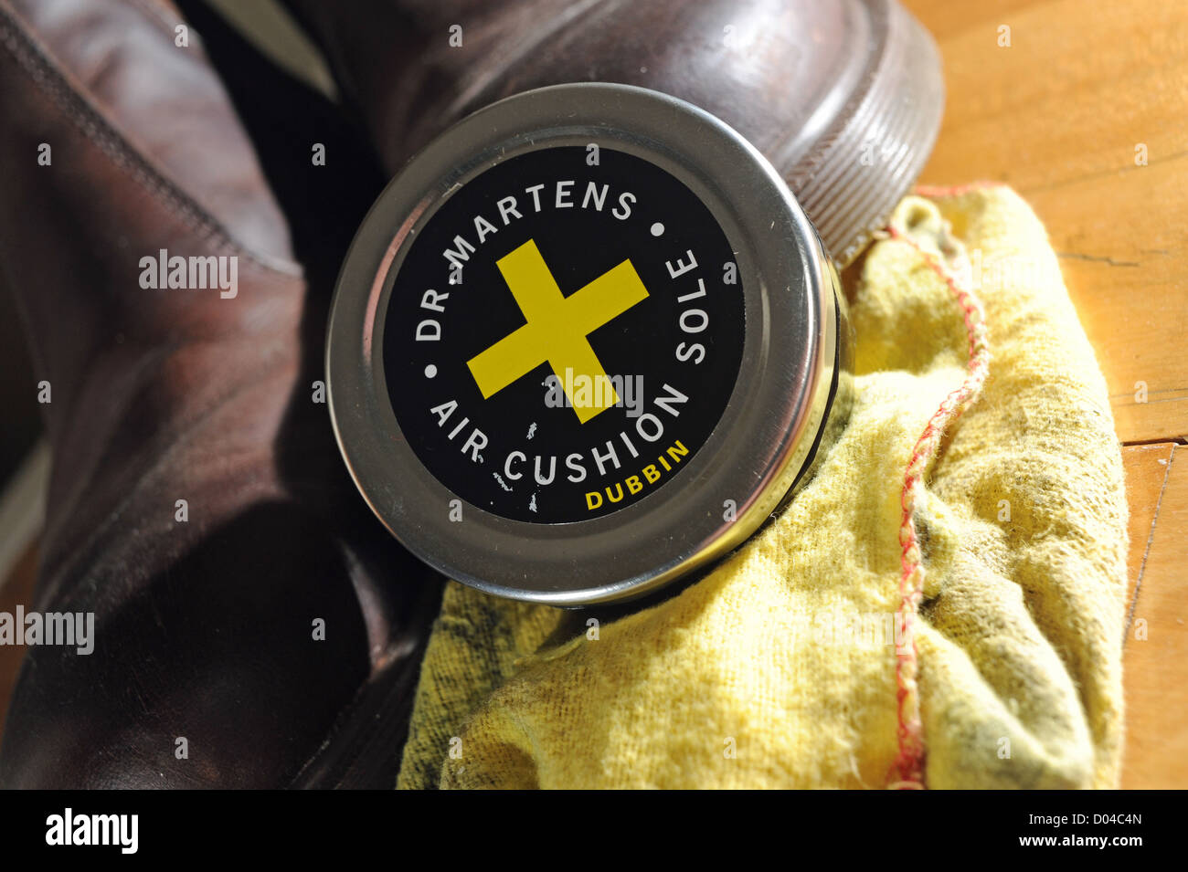 Pair of brown leather Dr Martens boots with dubbin shoe polish can and  cleaning cloth Stock Photo - Alamy