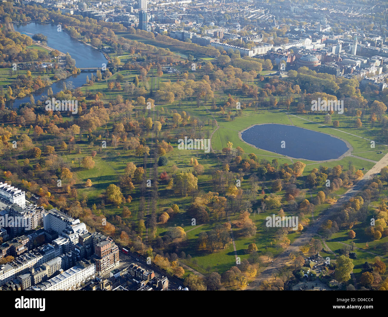 Autumnal colours in Hyde Park London, from the air, showing the Round Pond and The Serpentine left Stock Photo