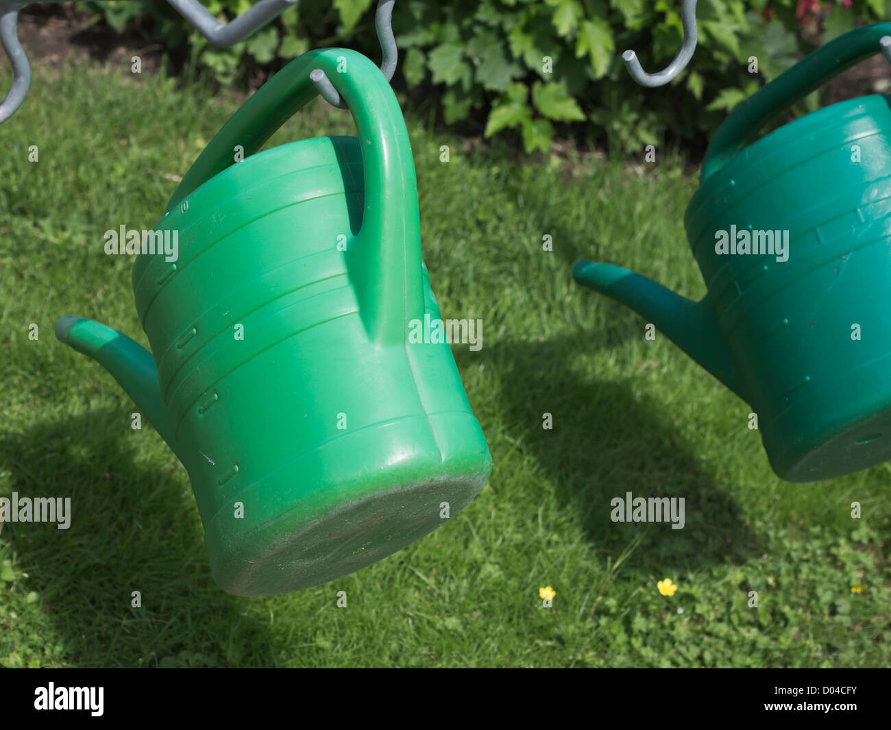 Plastic watering cans Stock Photo Alamy