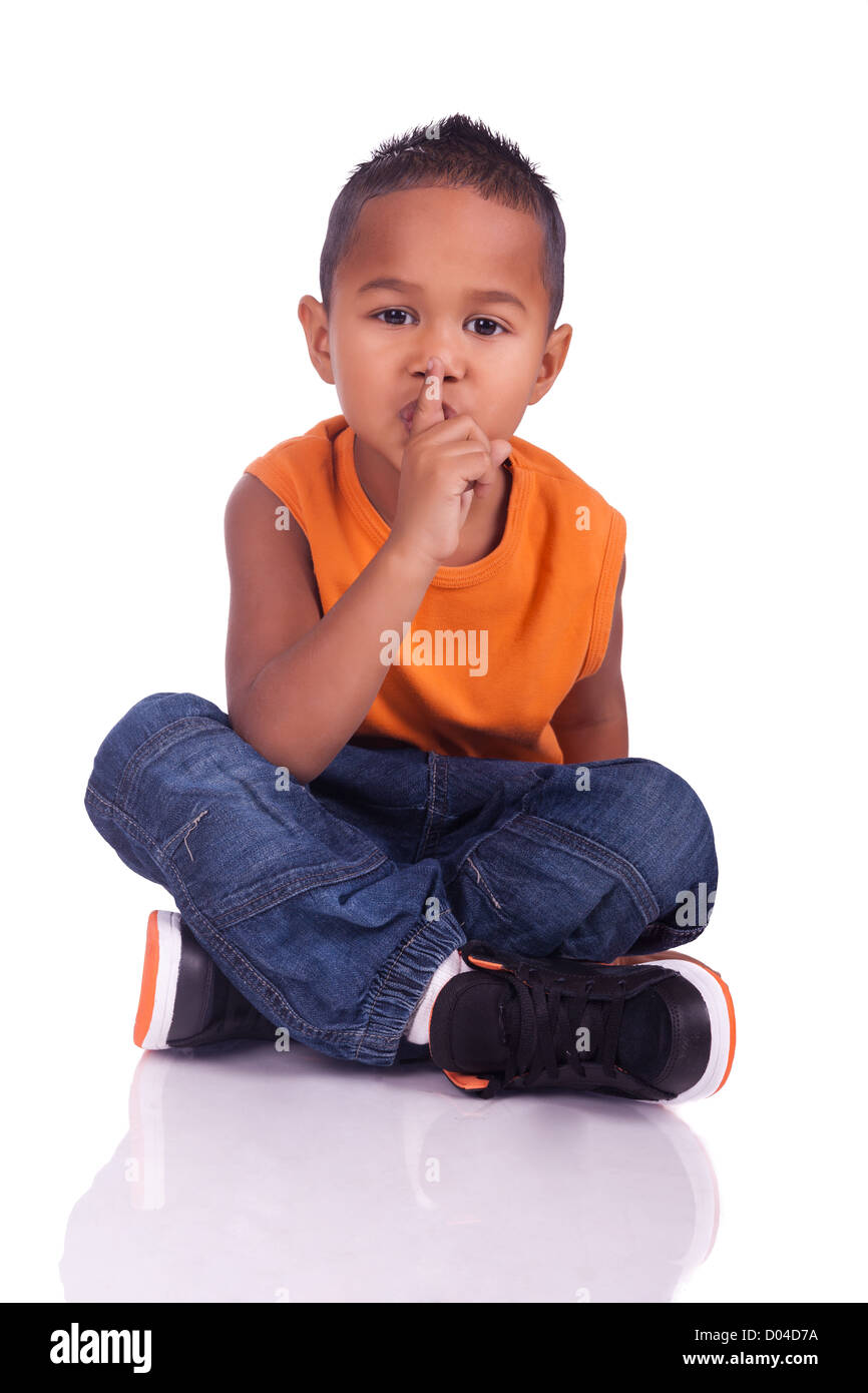A portrait of a cute asian boy seated on the floor Stock Photo