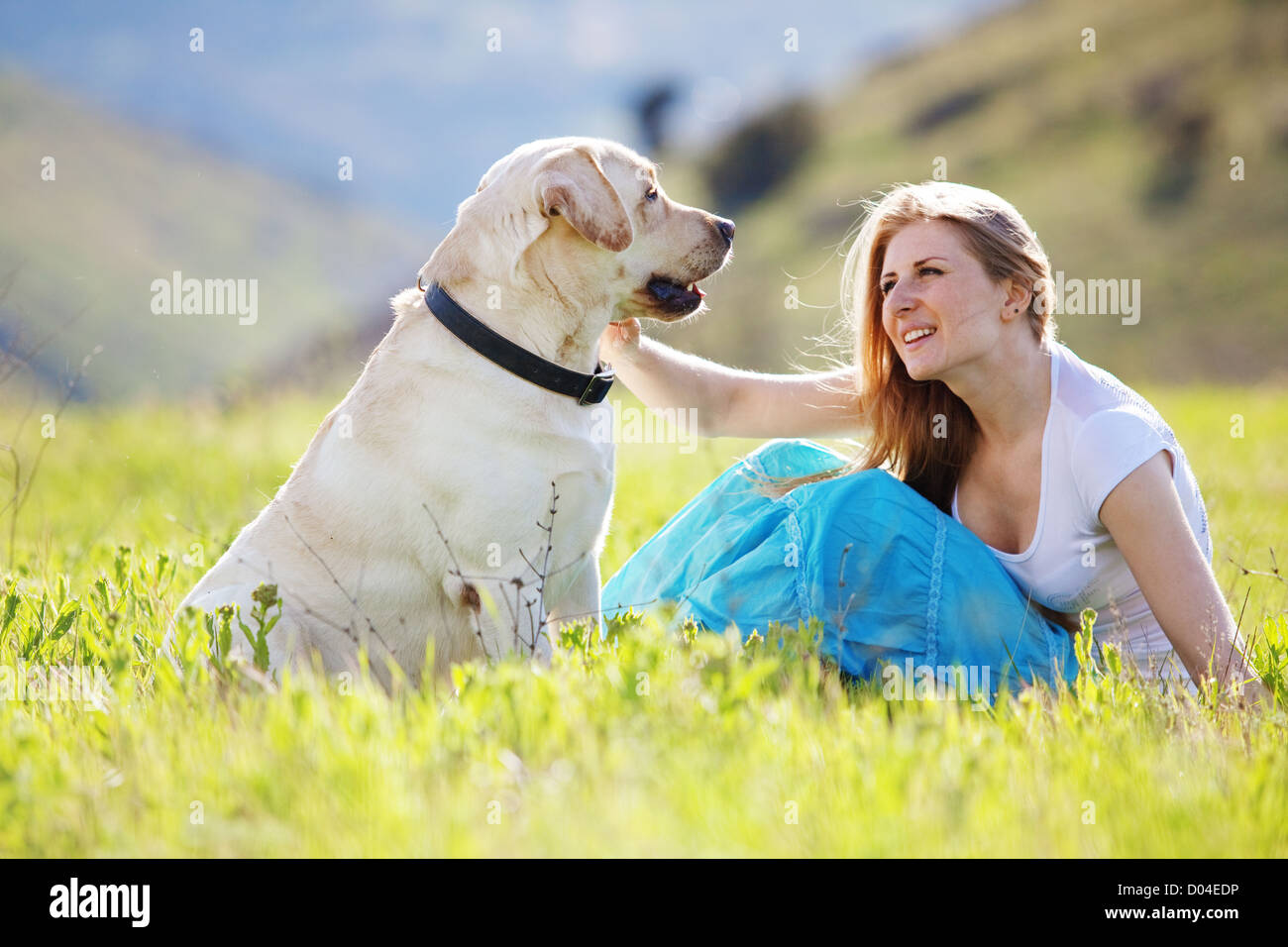 Young woman with her dog Stock Photo